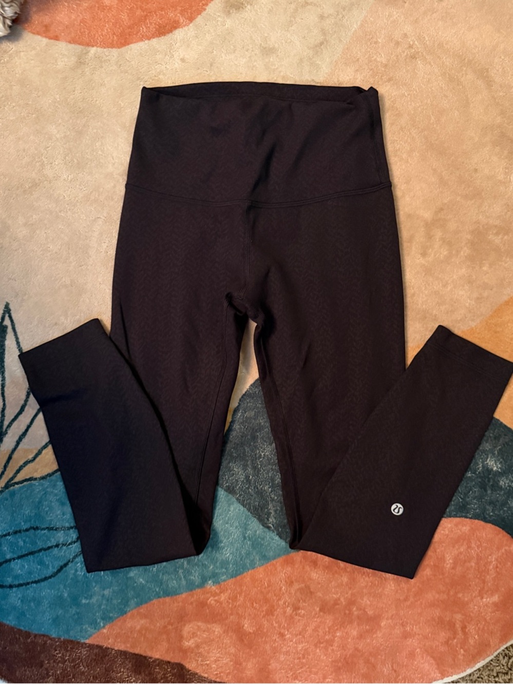 Women’s Lulu athletica Black with slight pattern up close. Sz. 4